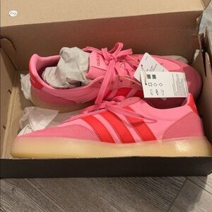 Pink and red adidas shoes